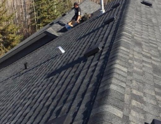 A man repairing a roof on a sunny day.